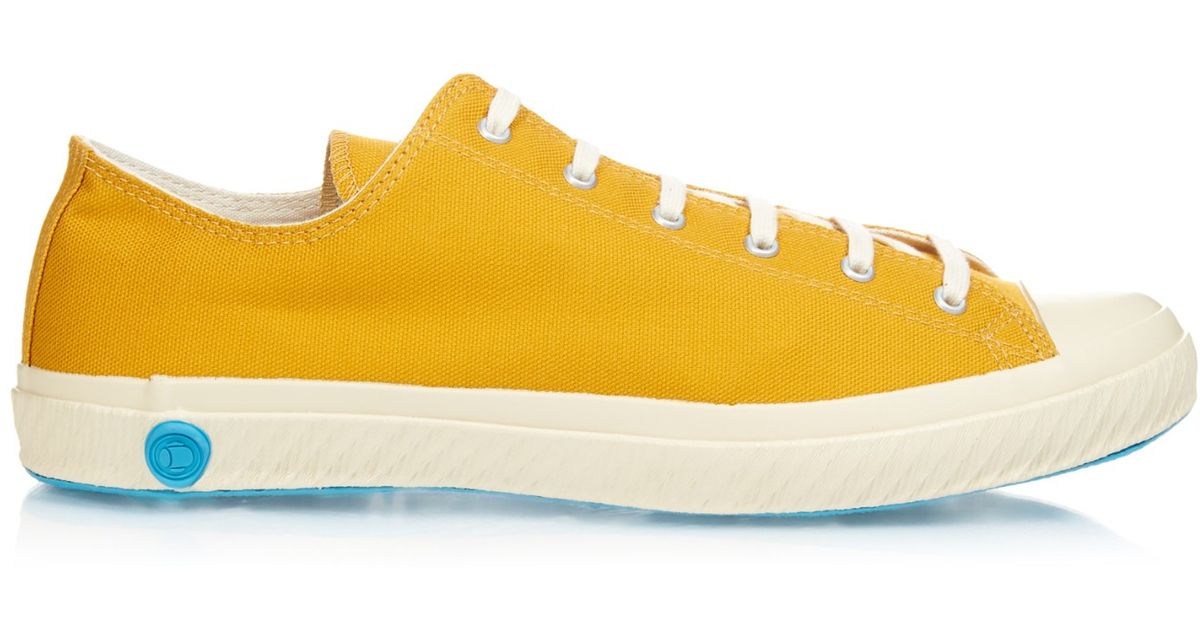 yellow canvas trainers