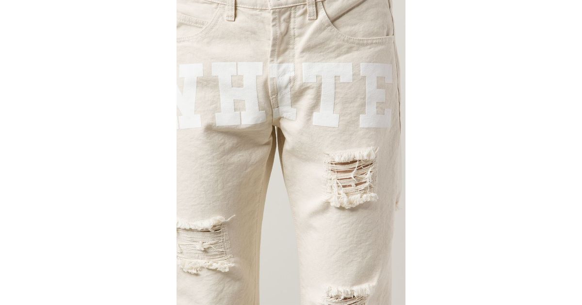 beige distressed jeans