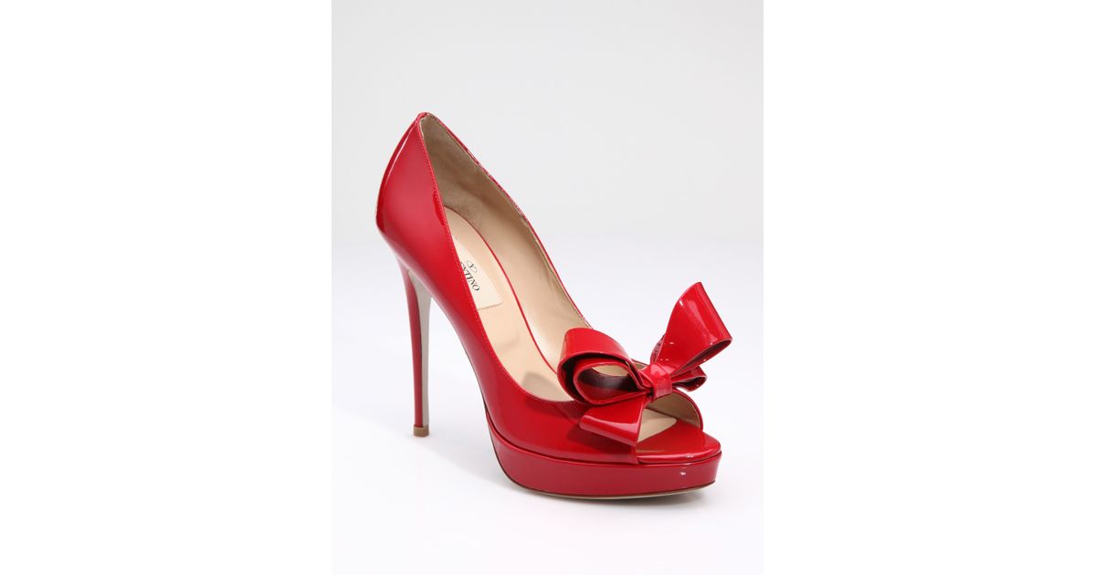 red patent leather open toe pumps