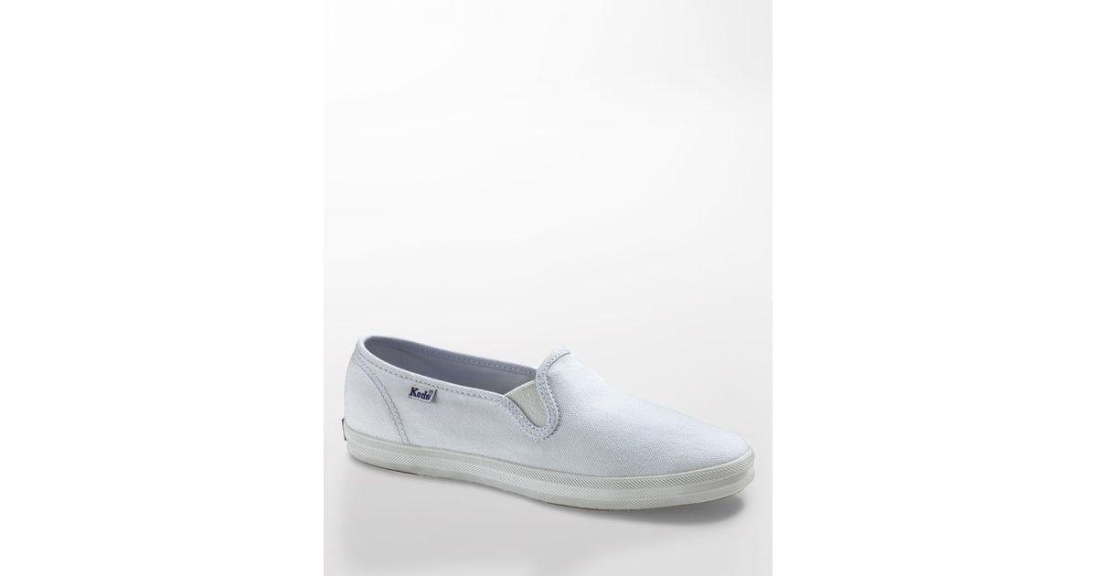 white canvas slip on keds