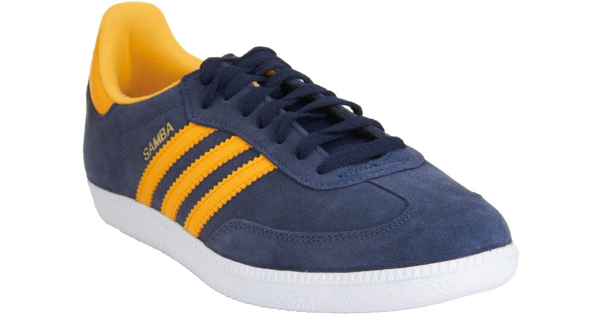 blue and yellow adidas samba trainers