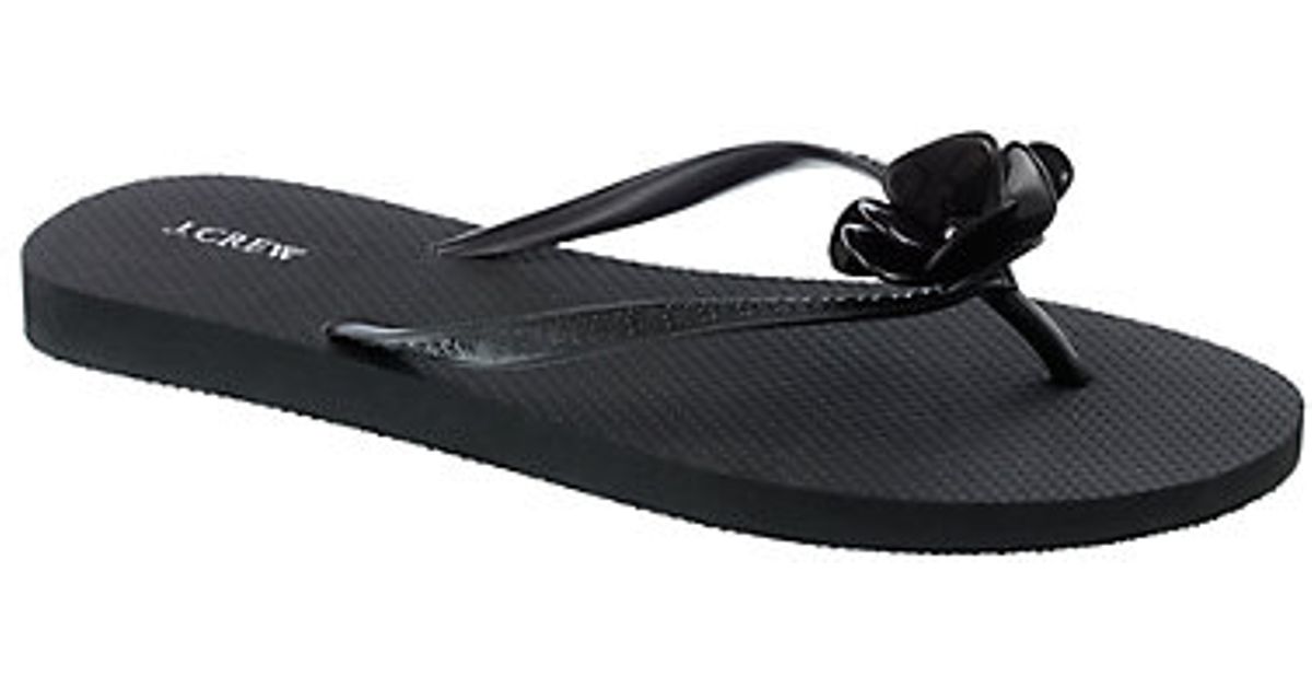 black flower flip flops