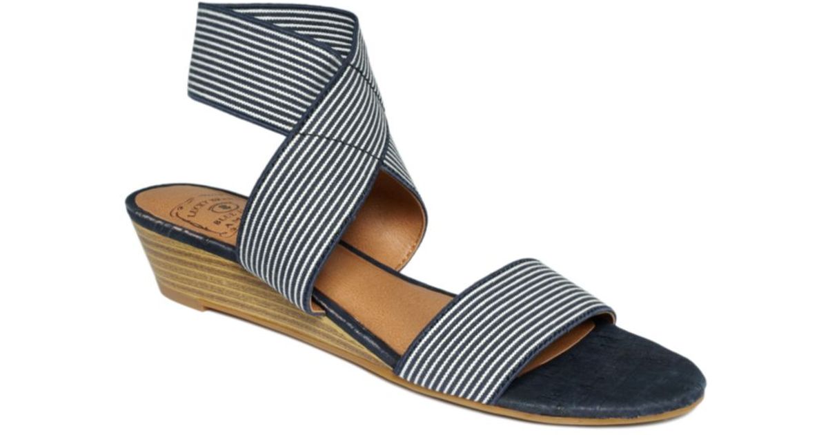 white elastic sandals