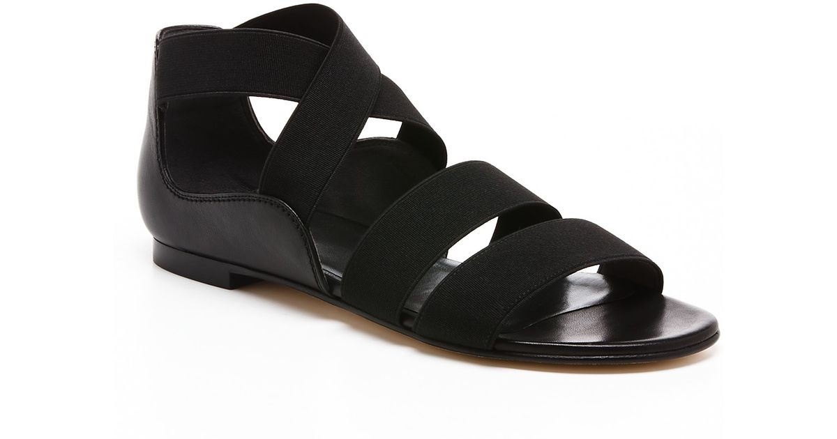 Stuart Weitzman Flat Sandals Bounce Elastic in Black - Lyst