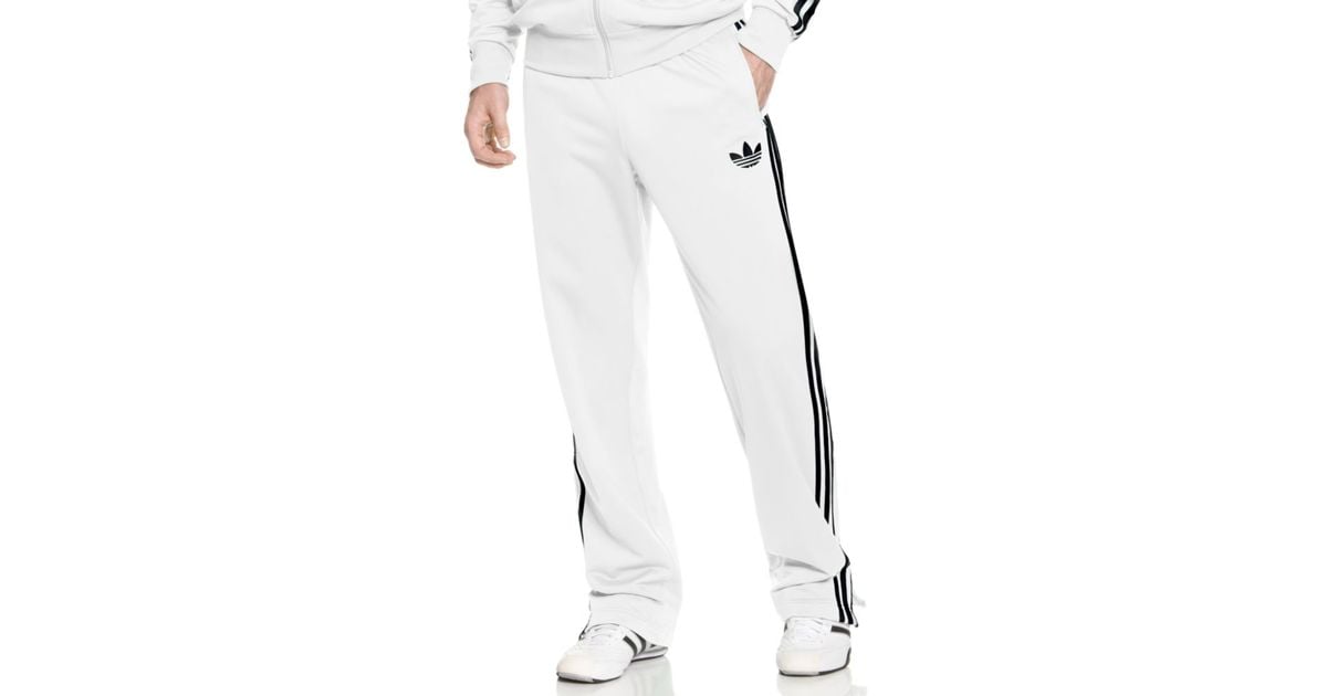 white and black adidas track pants