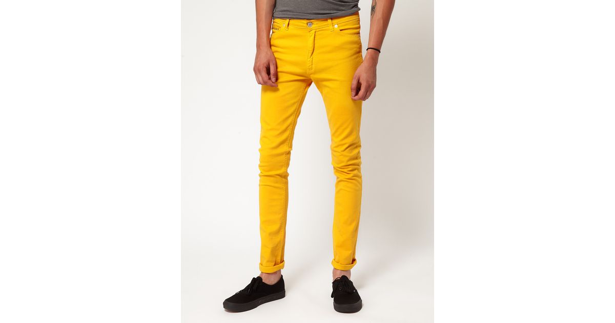 Yellow skinny store jeans mens