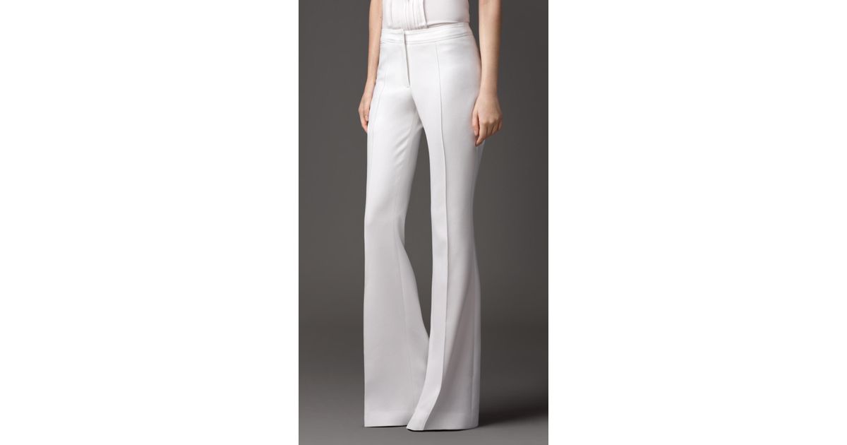 white tailored flared trousers