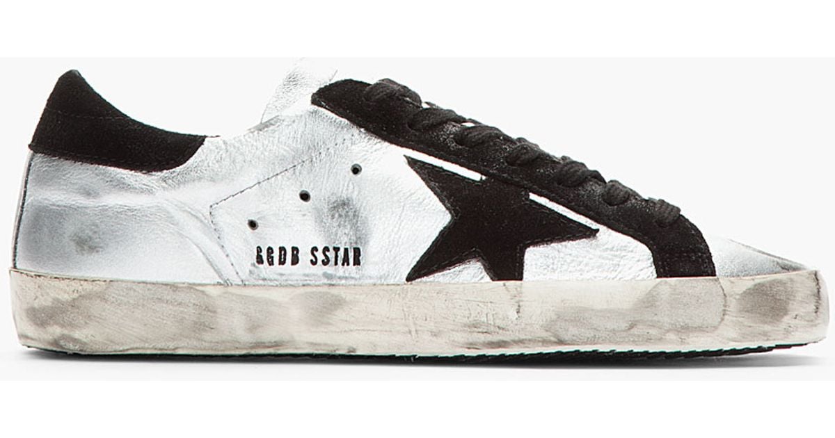 silver and black golden goose sneakers