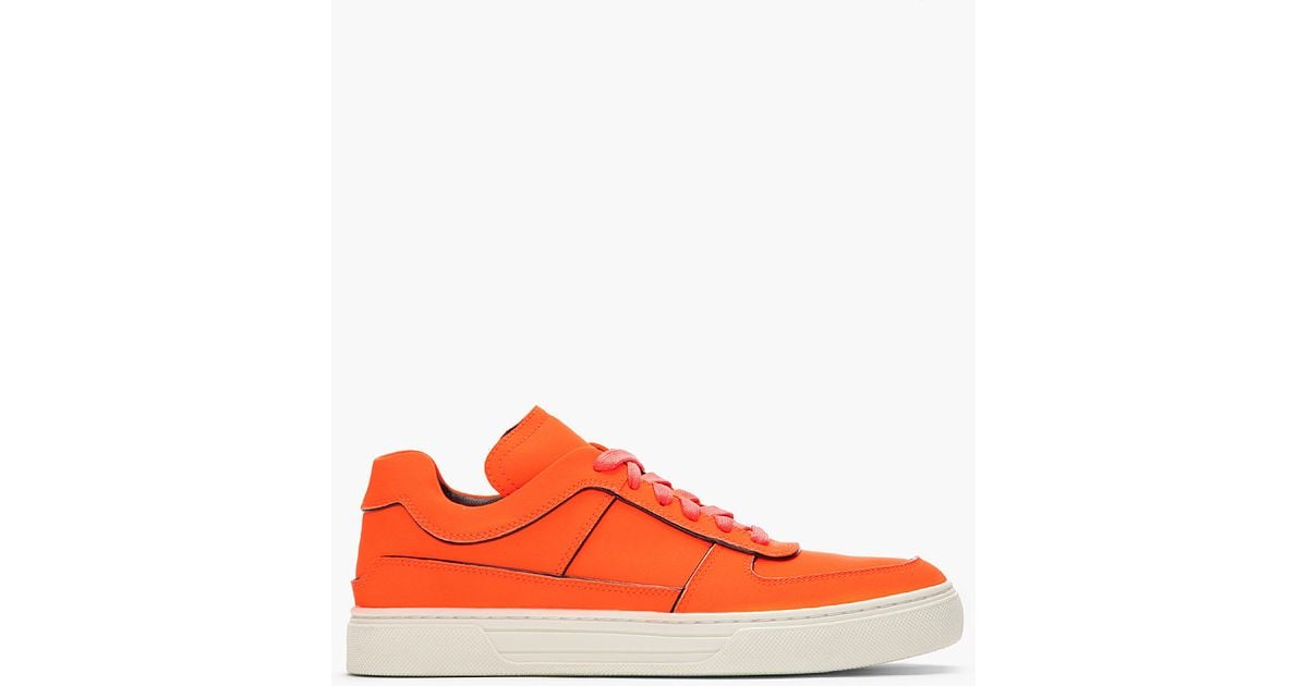 fluorescent orange sneakers