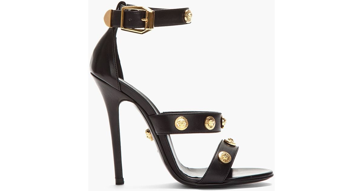 black heels with gold detail
