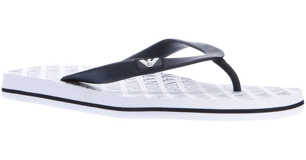 white armani flip flops
