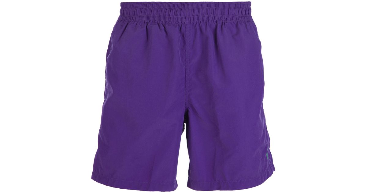 purple swimming shorts