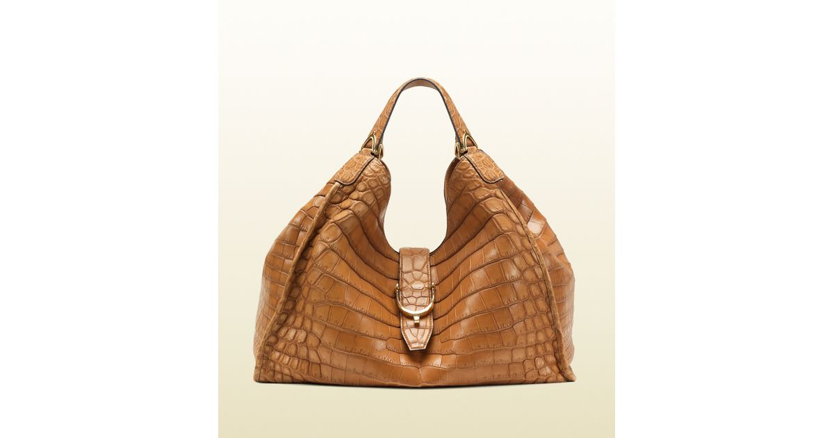 gucci women's brown stirrup leather shoulder bag