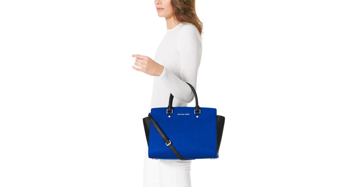 blue and black michael kors bag