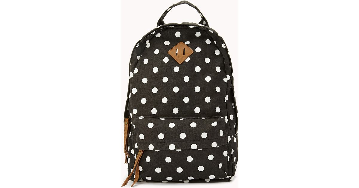 black polka dot backpack