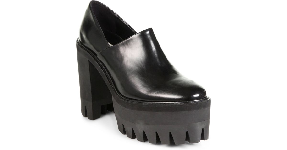 black platform clogs