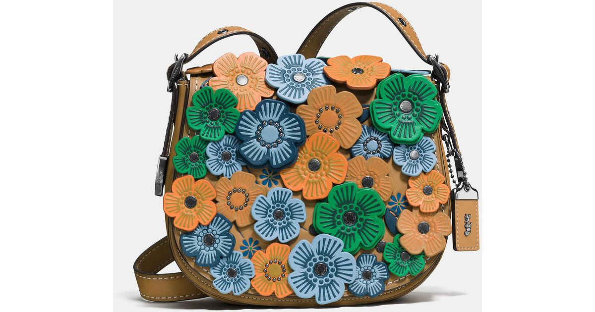 coach tea rose saddle bolsa