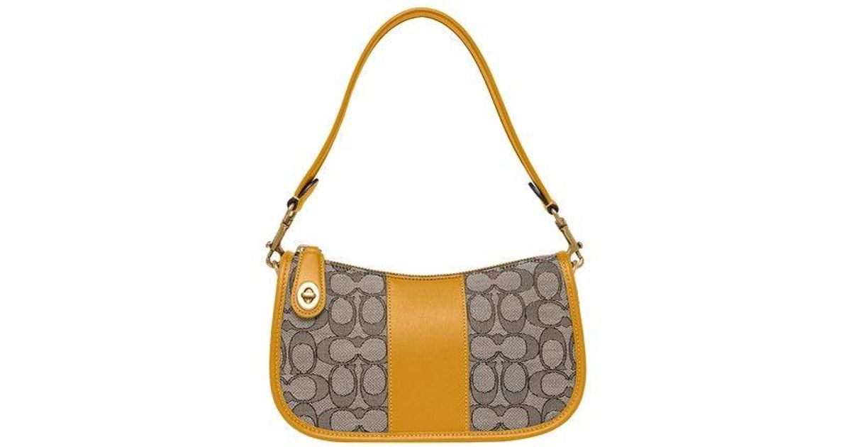 coach swinger bag in signature jacquard brown