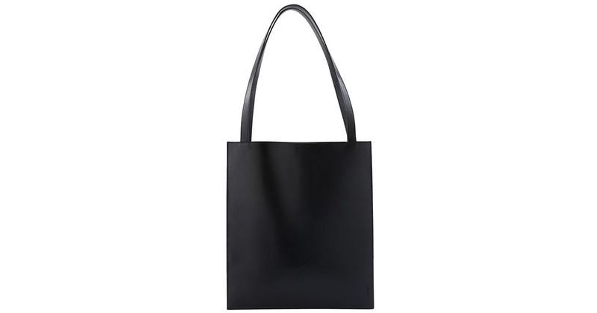 The Row Flat Tote Bag in Black Lyst