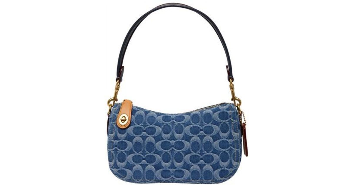 COACH Washed Denim Signature Swinger Bag in b4_indigo_midnight_navy