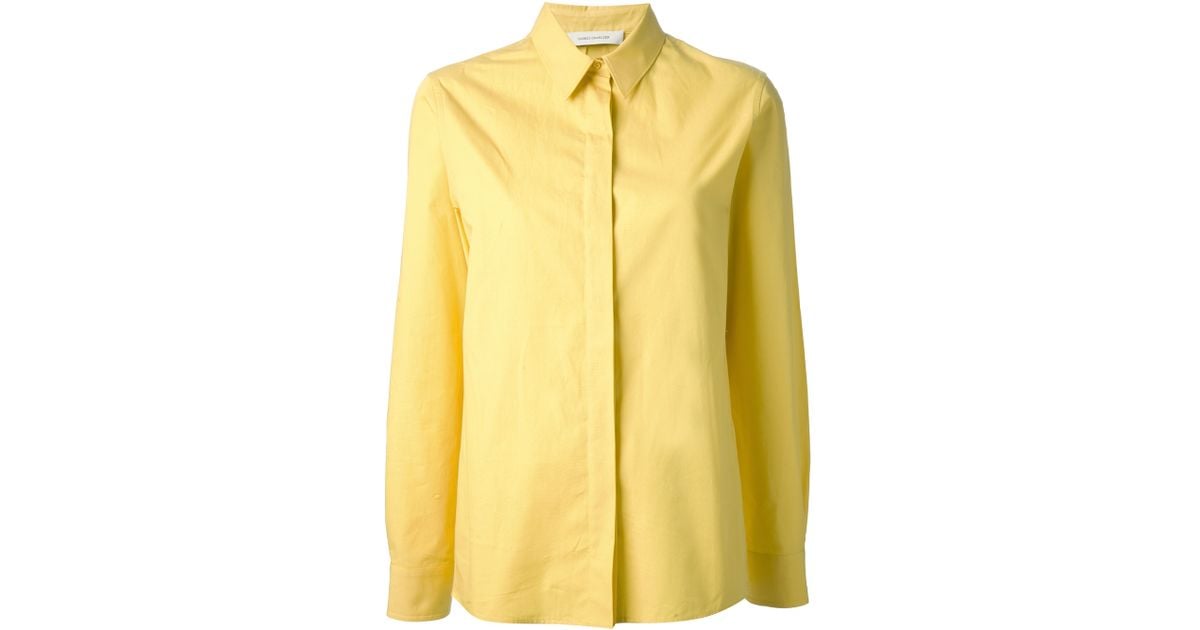 yellow collared shirt