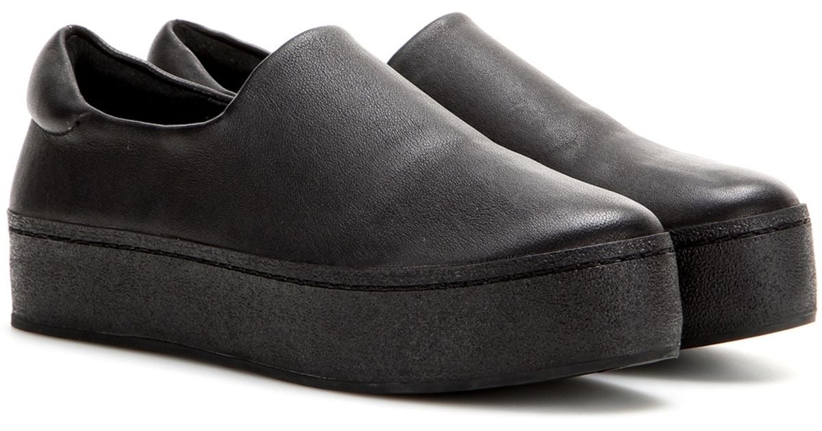 black leather platform slip on sneakers