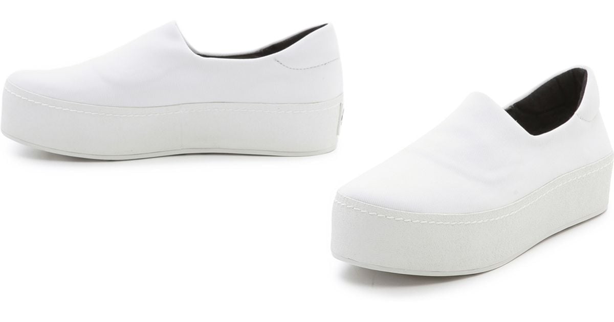 white slip on platform sneakers