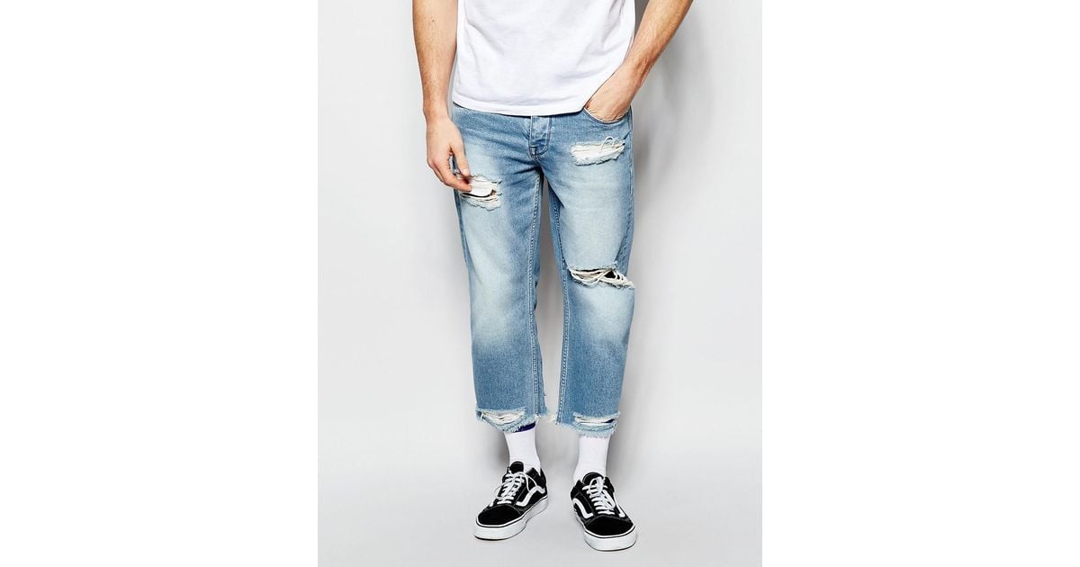 ASOS Denim Relaxed Jeans In Cropped Length With Raw Edge Hem Light