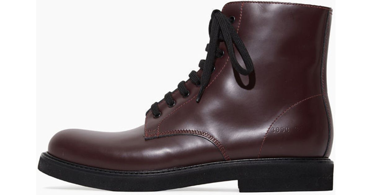 woman by common projects combat boots