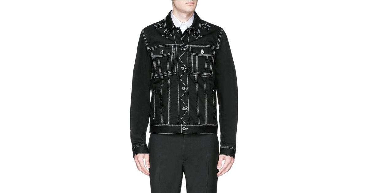 black jean jacket with white stitching