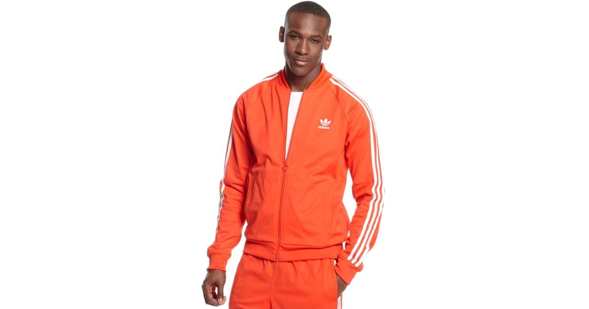 orange adidas track suit