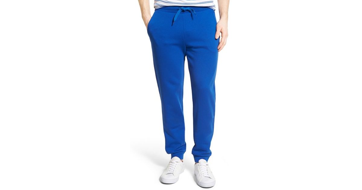 blue lacoste track pants