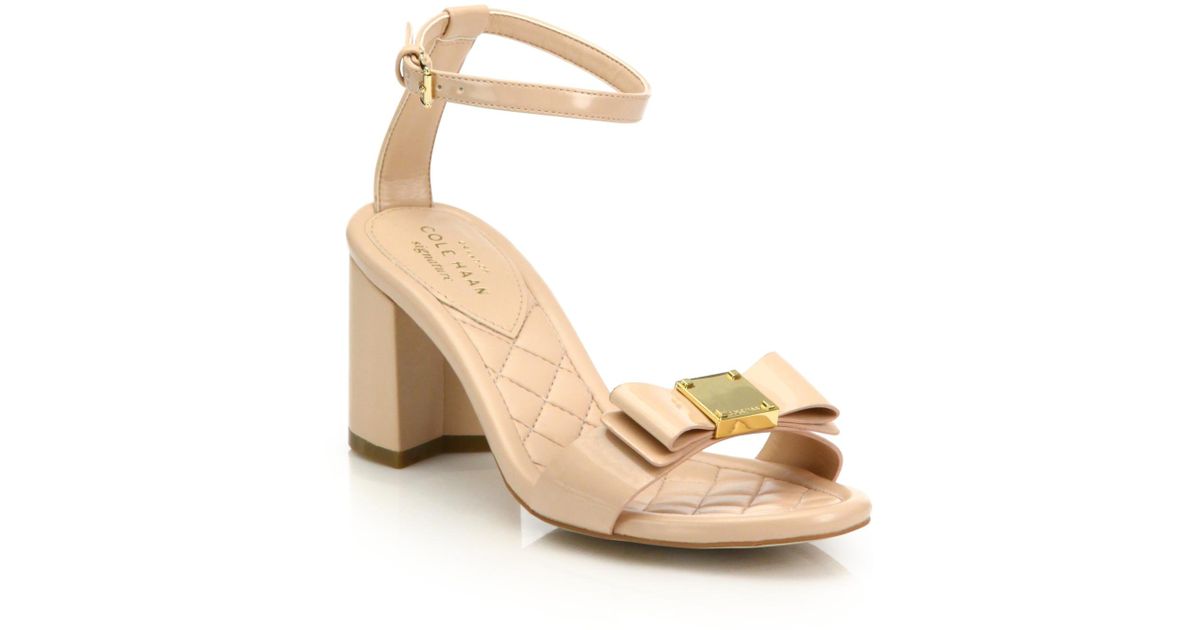 Cole Haan Tali Bow Patent Leather Sandals in Nude (Natural) - Lyst