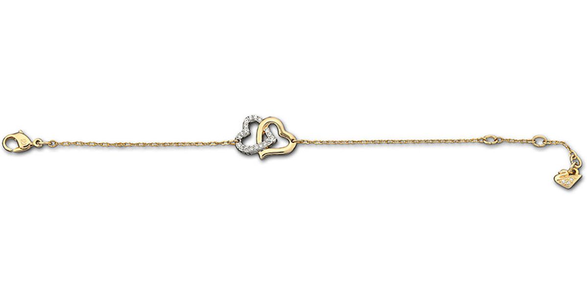 Lyst Swarovski Gold Tone And Crystal Double Heart Bracelet In Metallic