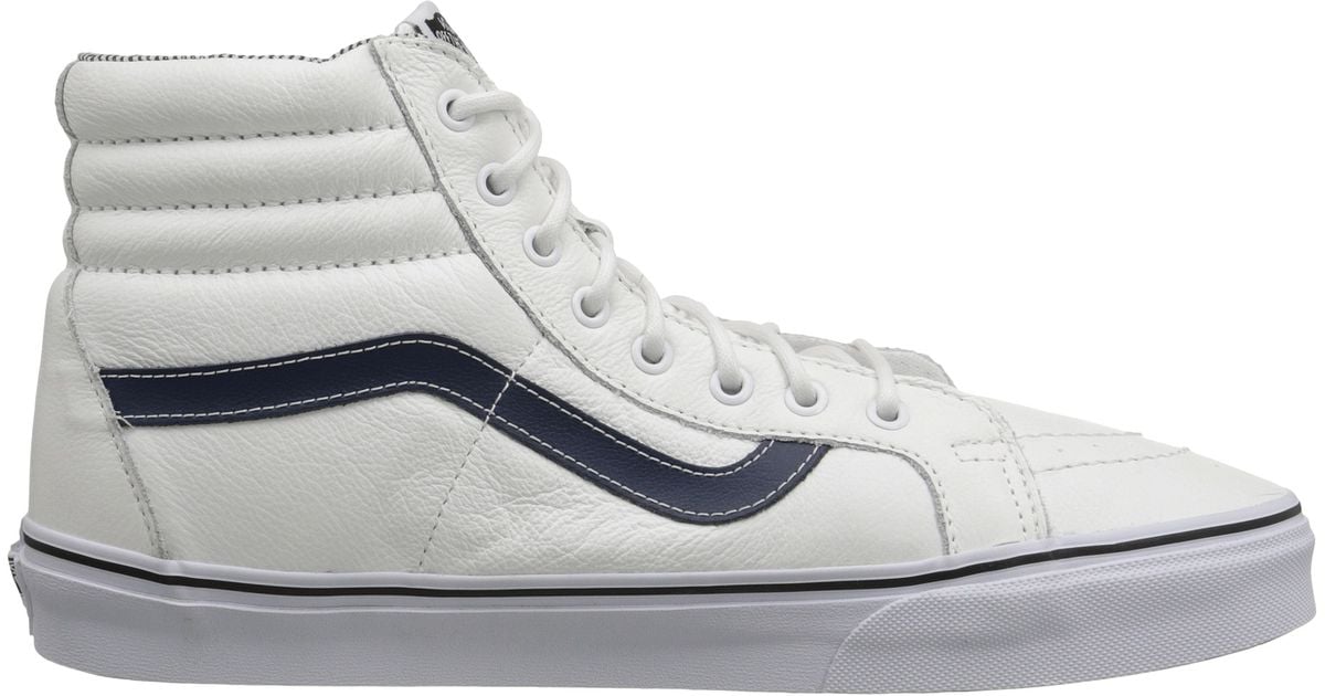 white leather vans with black stripe