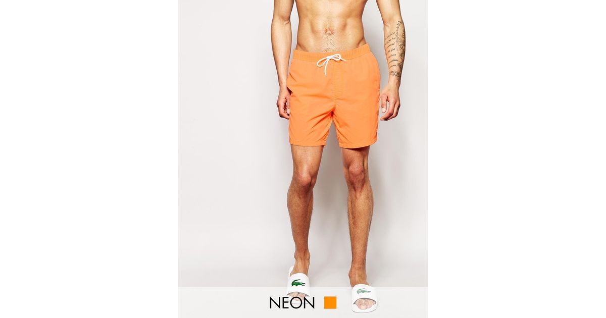 neon orange swim shorts