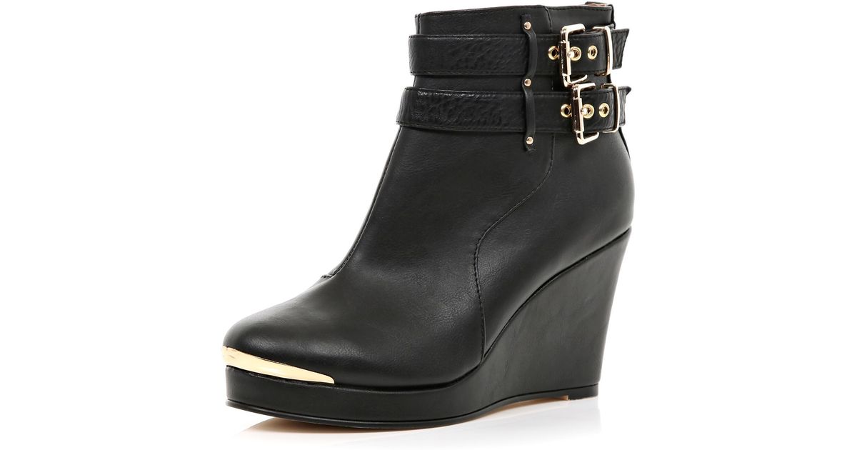 buckle wedge boots