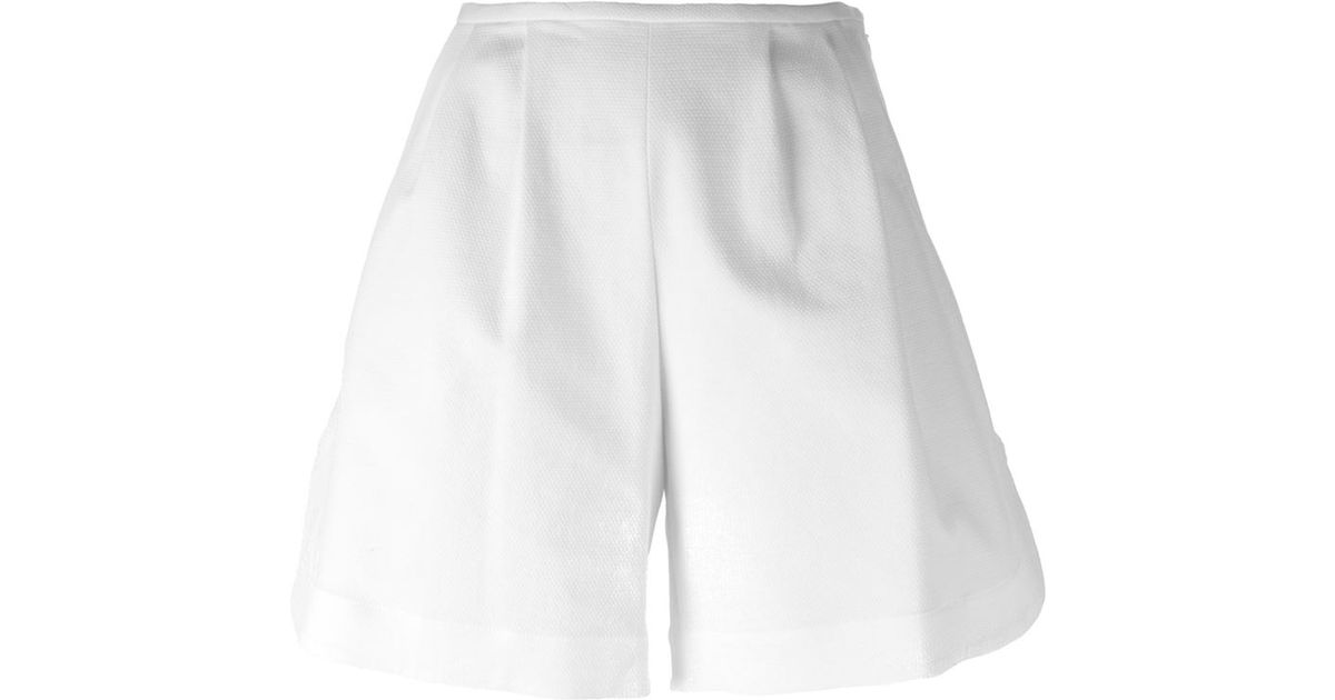 white flared shorts