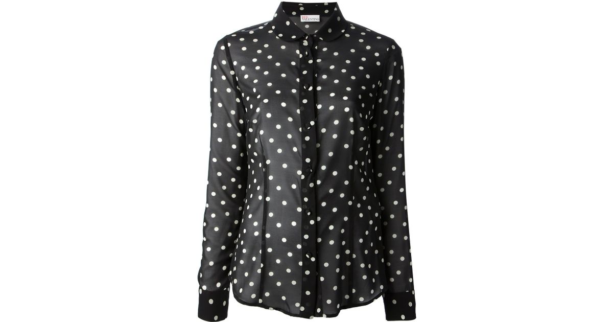 red blouse with black polka dots