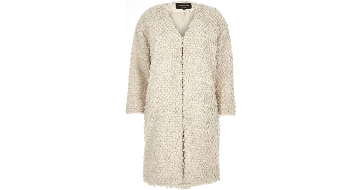 cream collarless coat