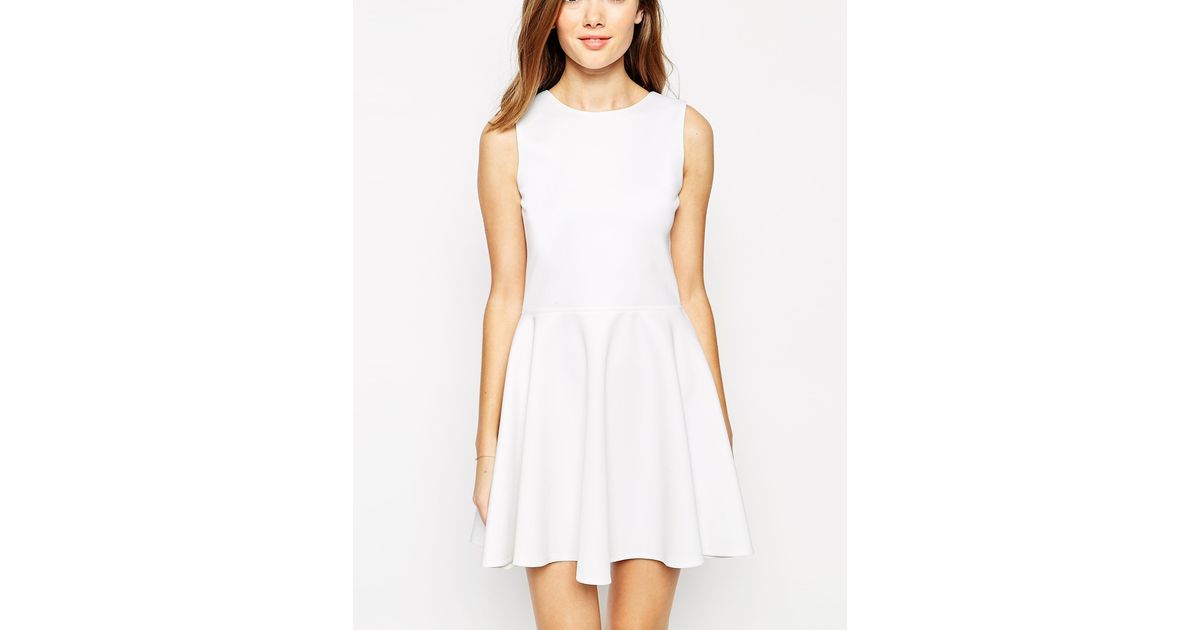white sleeveless skater dress