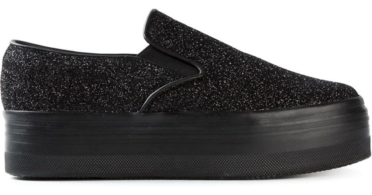 black platform slip on sneakers