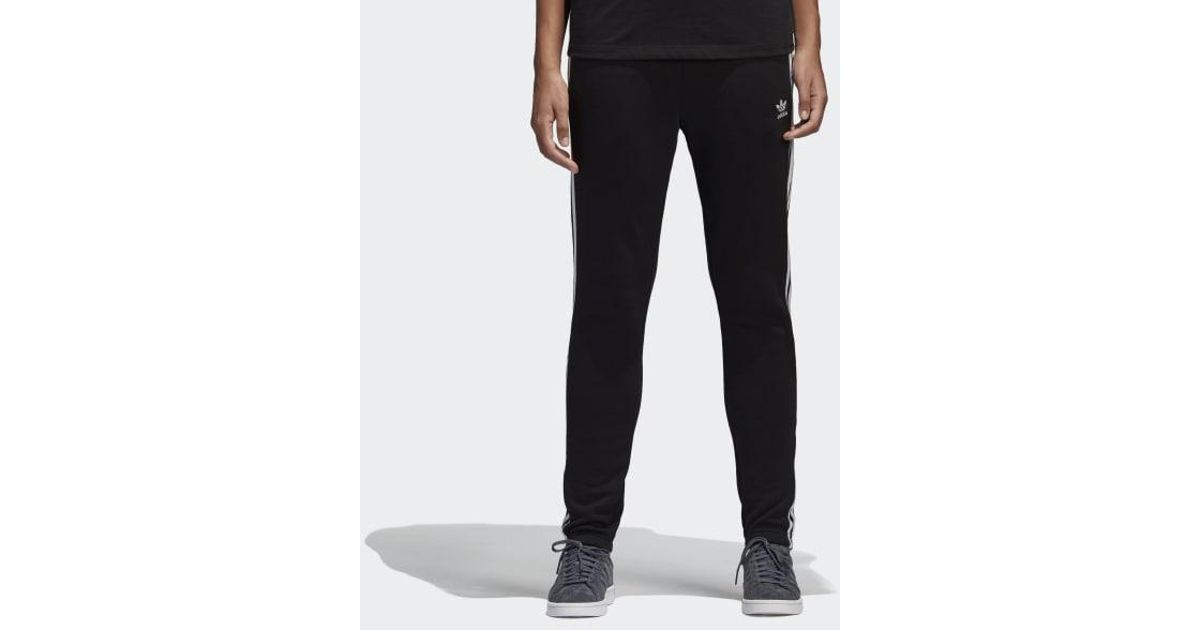 adidas originals adicolor three stripe cuffed joggers in black