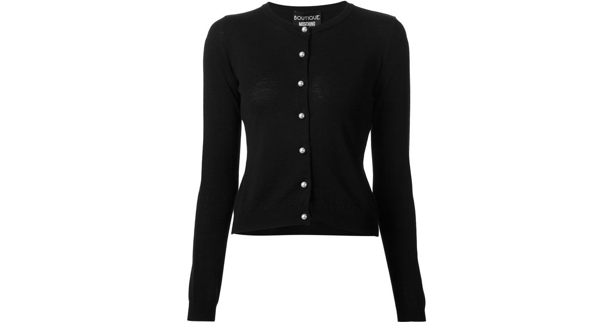 black cardigan with pearl buttons
