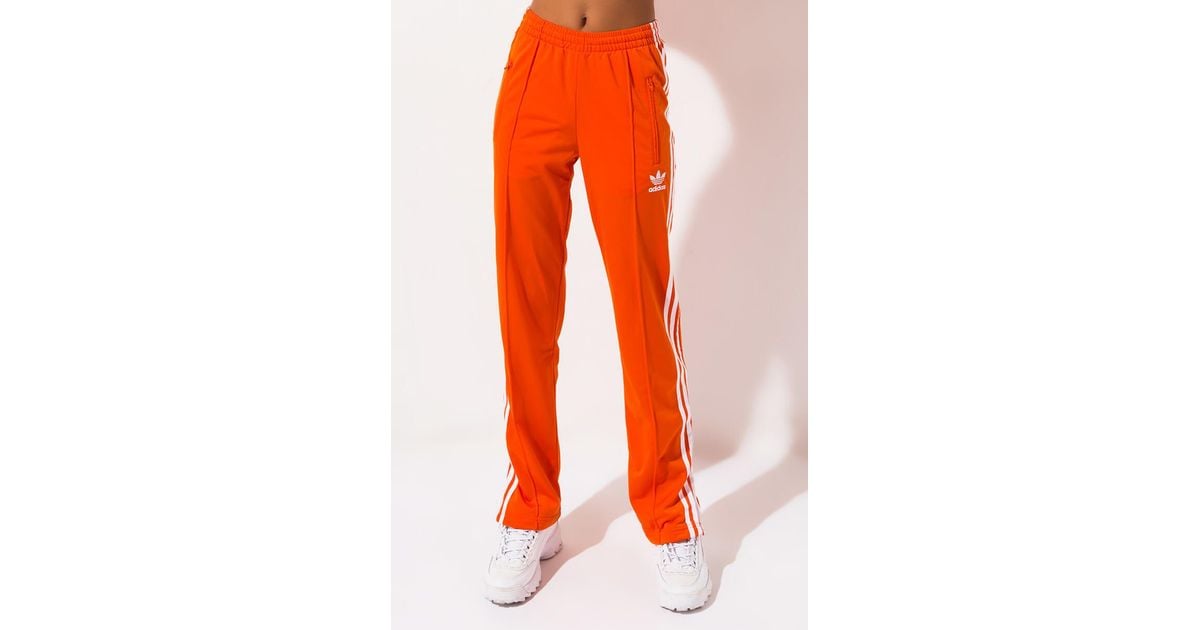 adidas track pants orange stripe