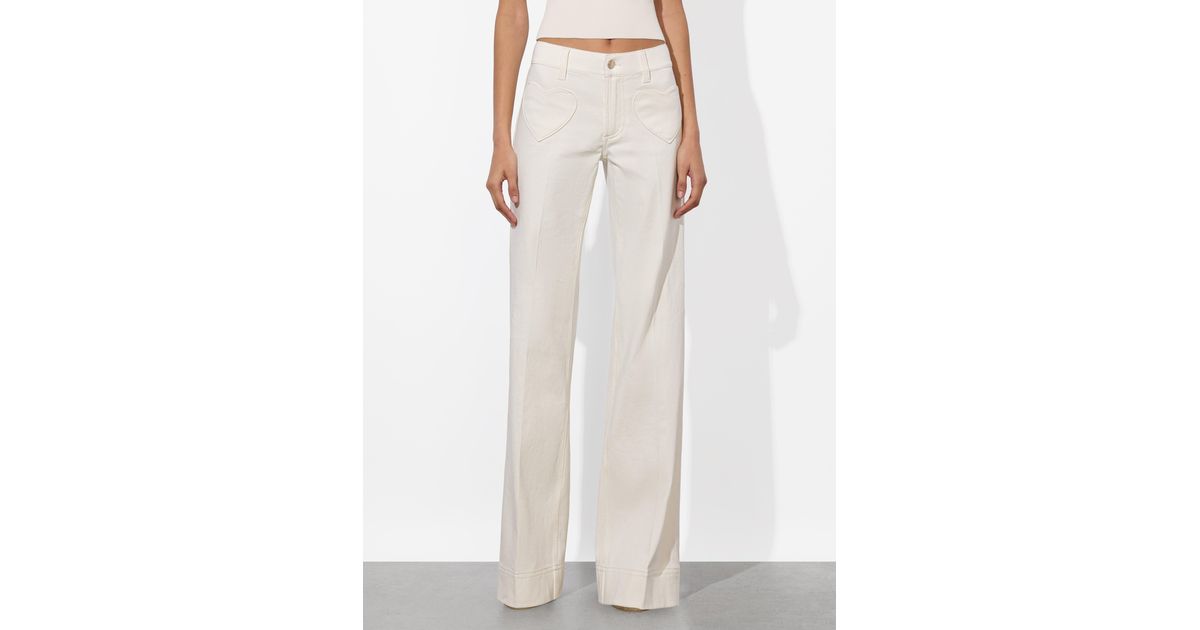 Alice + Olivia Slay Heart Front Jean in White | Lyst
