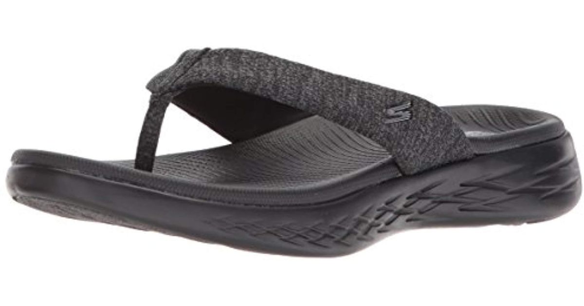 black sketcher flip flops