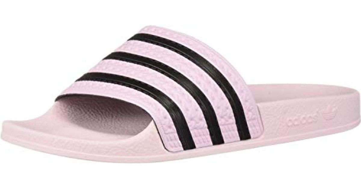 pink and black adidas slides