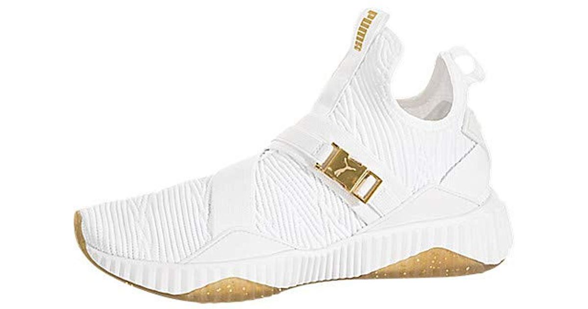 puma defy sneakers in white