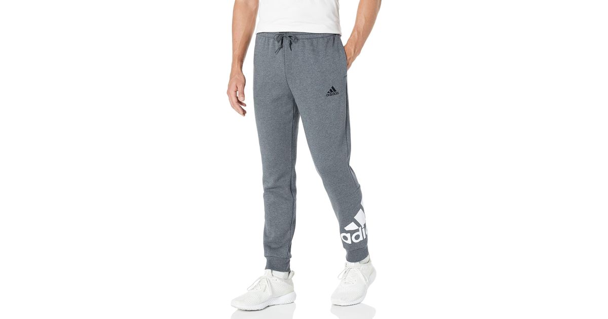 essentials fleece tapered cuff logo pants